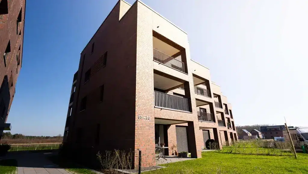 Helle Neubauwohnung mit 2-Zimmern und Tiefgaragenstellplatz in Senden - Aussicht - Haus von Aussen